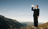 businessman-shouting-top-mountain-50805420-2784974066