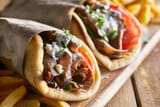 two-lamb-gyros-with-feta-cheese-tzatziki-sauce-allincrete.com_[1]