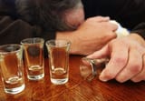 alcoholism--shot-glasses--mature-man-passed-out--157395625-5962bc483df78cdc68bb01bc