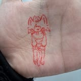 cat chara drawn on a hand