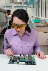 depositphotos_50614513-stock-photo-woman-soldering