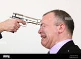 business-man-threatened-by-gun-AM4C56