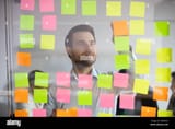 young-professional-busy-with-project-planning-on-kanban-board-2A9PR16