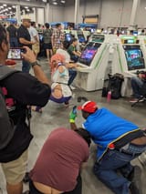 manon cosplay at evo being taken by fat guys with their asscracks out