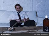 depositphotos_146765663-stock-photo-depressed-alcoholic-businessman-with-loose
