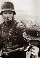 two-german-soldiers-lighting-a-cigarette-with-a-v0-ljr69qlvg89b1