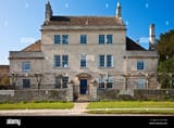 a-typical-large-18th-century-georgian-stone-country-house-or-mansion-CN19RG-1912942588