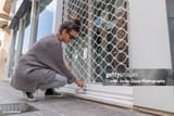 millennial-woman-openning-a-small-business-security-grill