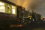 gwr_1500_class_loco_no_1501_of_the_severn_valley_railway_pulling_a_night_train_out_of_kidderminster