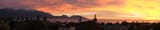 Sunrise over snow-capped Seaward Kaikoura Range and Kaikoura - panorama