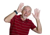 old-man-waving-both-hands-9838521