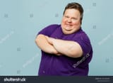 stock-photo-side-profile-view-young-chubby-overweight-fat-man-wears-purple-t-shirt-casual-clothes-hold-hands-2355348495
