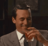 drinking while laughing