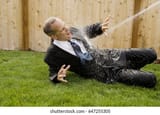 business-man-being-sprayed-water-260nw-647255305