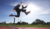 business-man-jumping-hurdle-smaller-e1431706146563